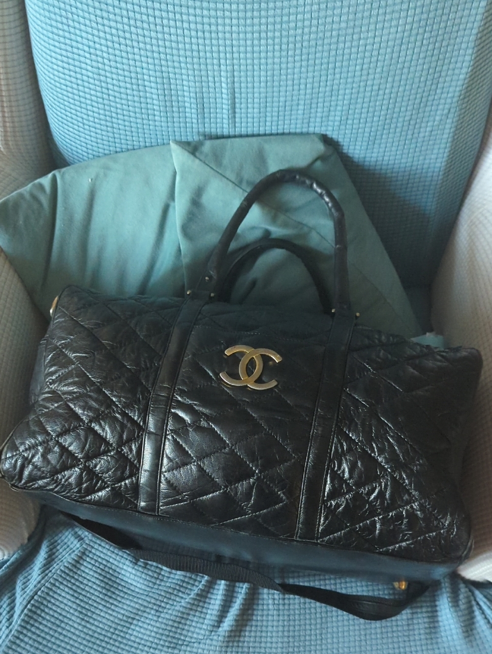 C H A N E L Black Quilted Leather Travel Bag with CC Logo